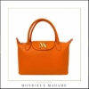 MonDieux Madame Design belge, fabriqué en Italie. Sacs à main en cuir éditions limités. Class et branché @Once ! Sacs en cuir de chez Mondieux Madame , design Qui rappelle le petit Longchamp. Tout en cuir de couleur Orange
